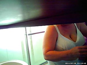 Son sets up spycam in shower to see mom'_s huge tits
